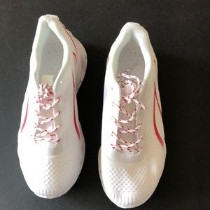 Women’s light weight walking shoes. White with red accents.